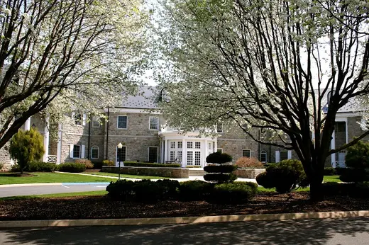 Blooming trees framing the entrance of Ashley Addiction Treatment – Main Campus, a detox center in Baltimore.