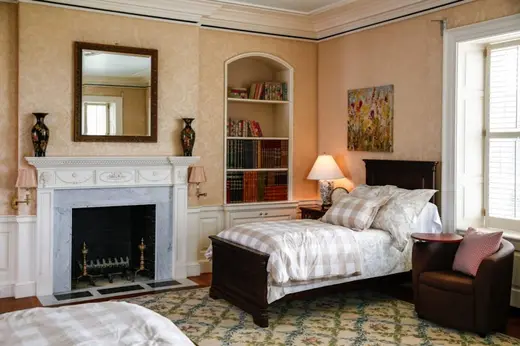Cozy bedroom with two beds at Recovery Centers of America at Bracebridge Hall, a detox center in Baltimore.