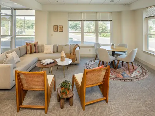 Sunlit shared living room at Alpas Wellness Maryland Recovery Center, a detox center in Baltimore.