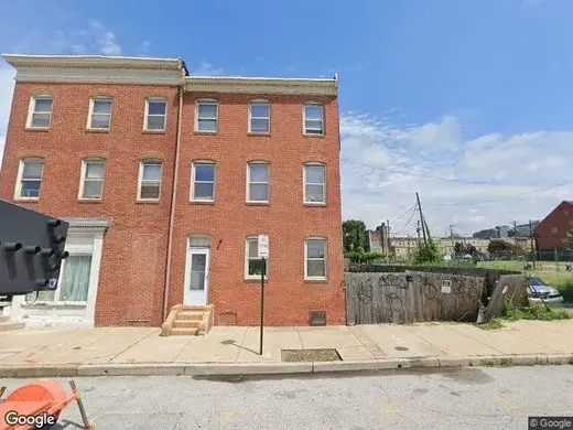 Red brick exterior of Earl's Place Transitional Housing, a sober living home in Baltimore.