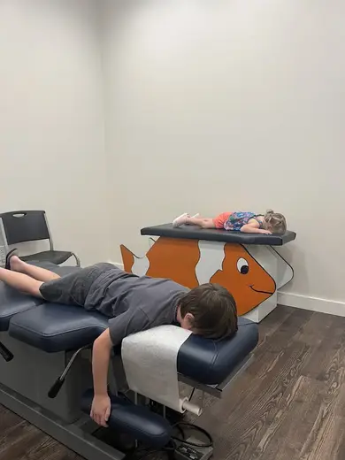 Playful therapy room with kids lying on treatment tables at Apex Wellness Group LLC, a sober living home in Baltimore.