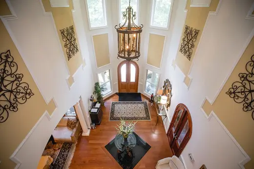 Grand foyer with chandelier at Tranquility Woods LLC, a sober living home in Baltimore.