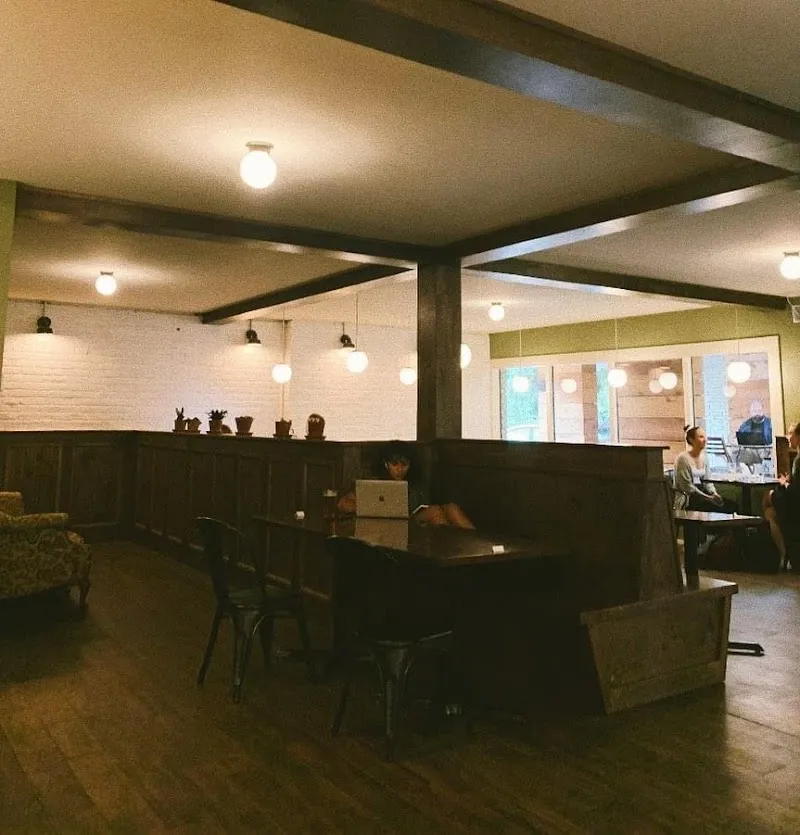 Bright communal space with seating at Pinewood House, a sober living home in Baltimore.