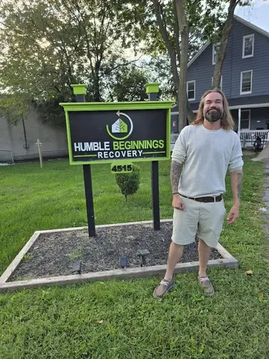 Welcoming sign for Humble Beginnings Recovery, a sober living home in Baltimore, with green accents and manicured lawn.