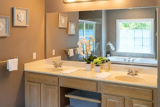 Bright bathroom with double sinks at Sober Living - Luxury - Severn Home, a sober living home in Baltimore.