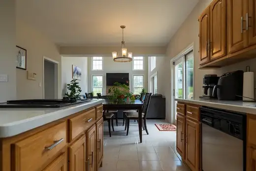 Bright dining area with large windows at Women's Sober Living - Severn Home, a sober living home in Baltimore.
