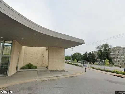Curved entrance to Ascension Saint Agnes Hospital Rehabilitation Services treatment center in Baltimore.