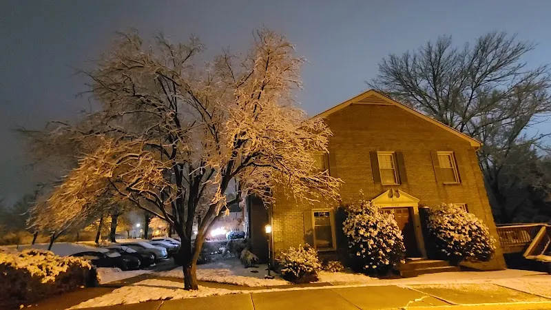 Snow-covered tree in front of Chase Brexton Healthcare treatment center in Baltimore.