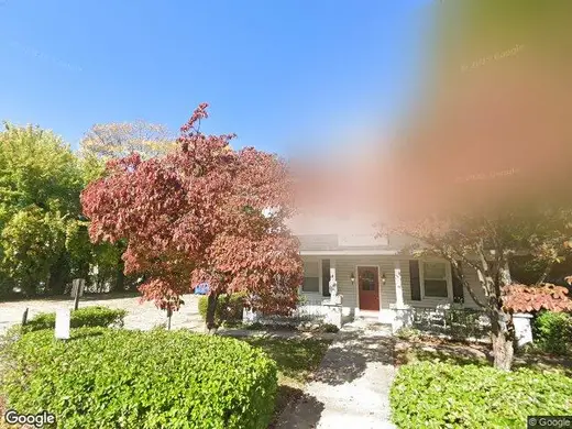 Charming exterior with vibrant trees at New Journey Inc, a treatment center in Baltimore.